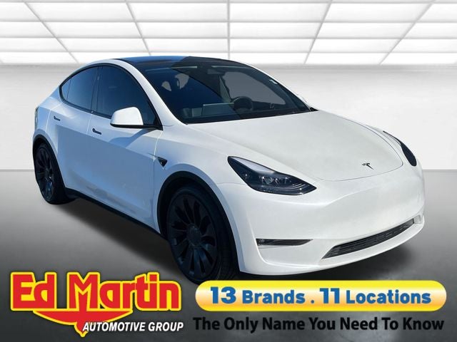 2023 Tesla Model Y Performance in Pearl White — front three-quarter view